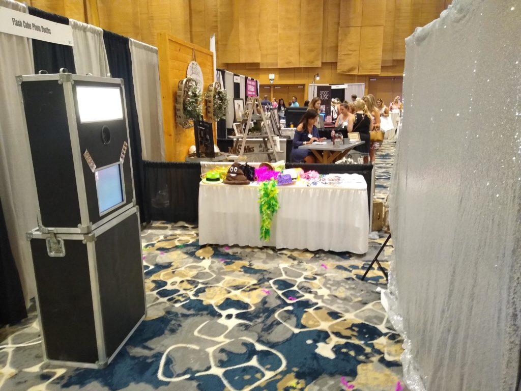 Our open photo booth with a silver sequin backdrop at Bridalrama